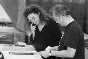Pat Steir and John Yau working next to each other